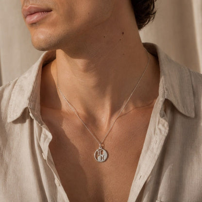collana personalizzata con due simboli zodiacali in acciaio